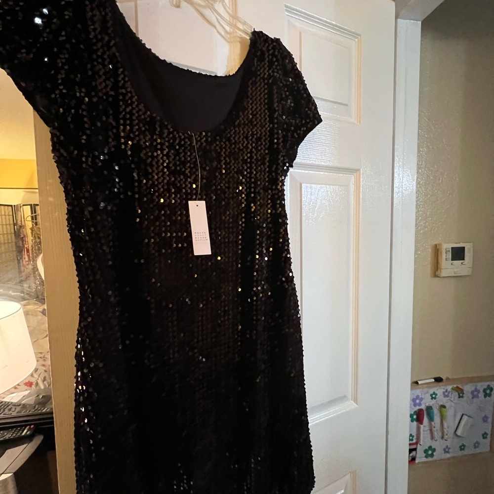Black Sequin Short Sleeve Dress size M
Never worn Great for Nee Years Eve